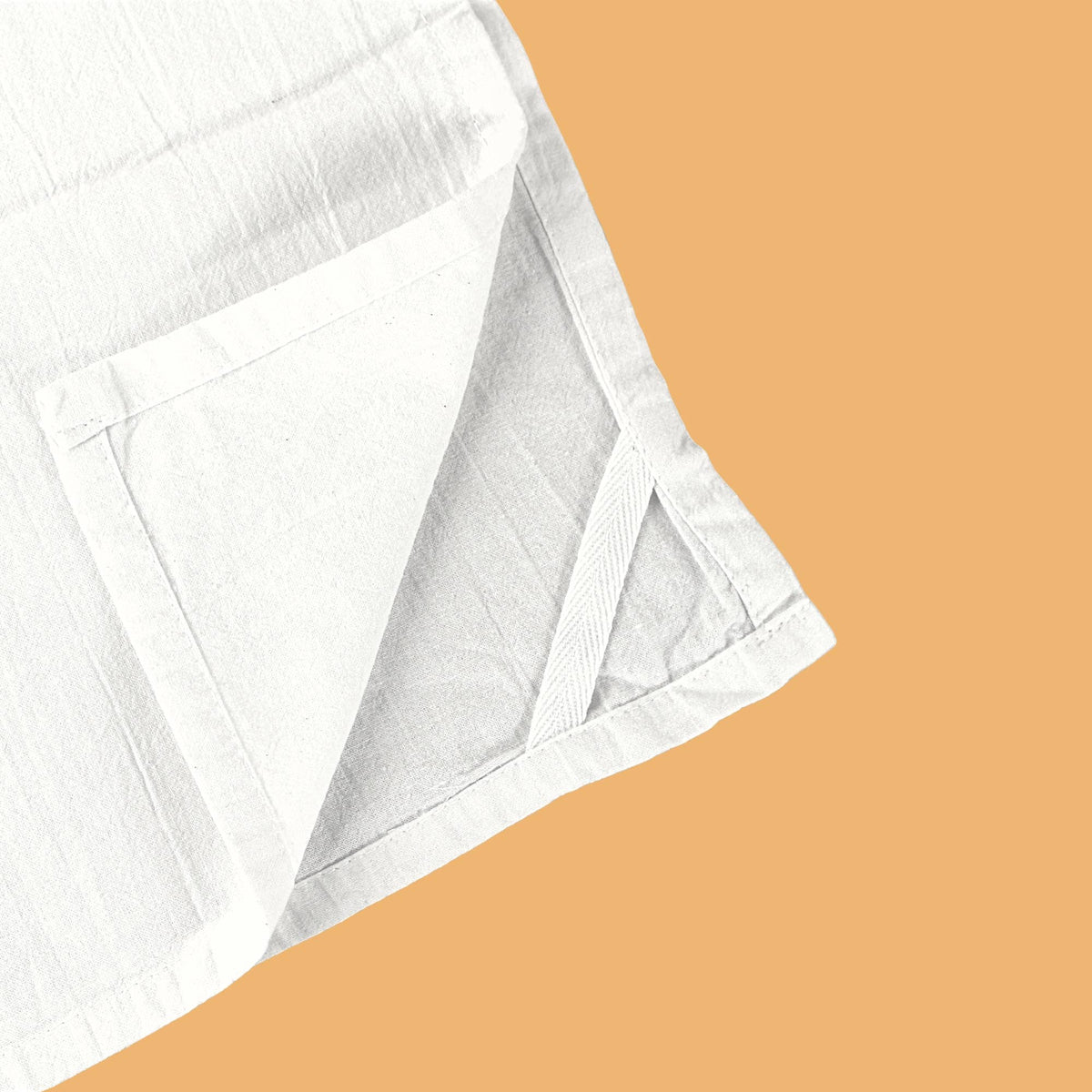 White fabric on a beige background