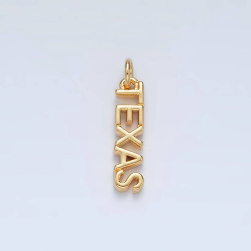 Gold 'TEXAS' pendant on a light gray background