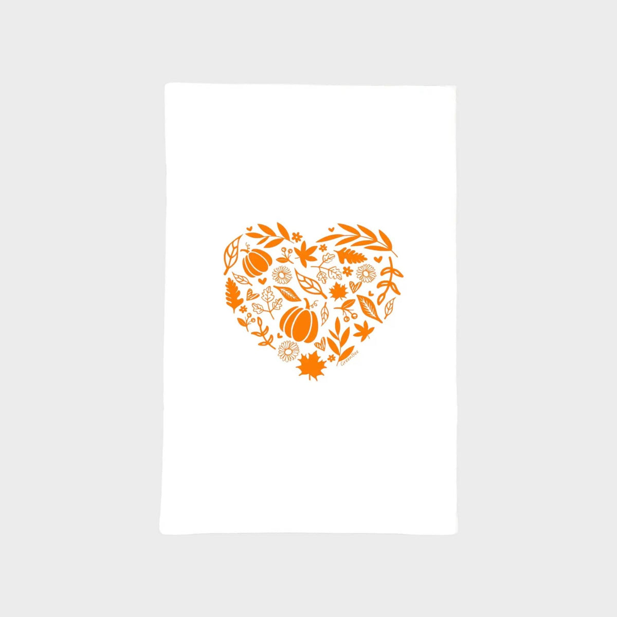 A white rectangular fabric item, likely a tea towel or blanket, featuring a central orange heart-shaped graphic filled with autumn motifs including pumpkins, leaves, and flowers, set against a light gray background.