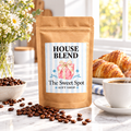 House Blend coffee in a Sweet Spot Gift Shop kraft bag with blue stripe label and pink gift box logo